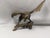 An impressive vintage solid brass eagle sculpture depicting a majestic bird of prey poised on a naturalistic tree branch...