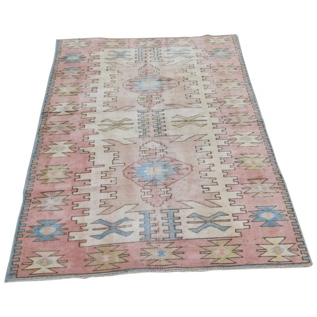 Hand-knotted with care using traditional rug-making techniques, this wool rug blends timeless craftsmanship with a modern...