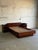 This queen platform bed frame boasts a sleek profile and exceptional craftsmanship. The expansive headboard incorporates...