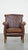 Dark brown cowhide English style armchair/armchair with a robust appearance. This fantastic cowhide leather armchair has a...