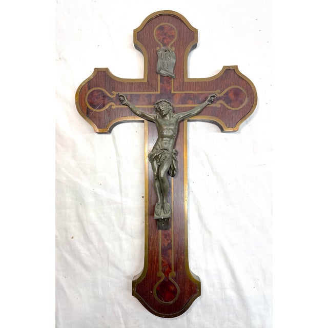 This Antique 19th century French bronze patinated metal and inlaid wood wall crucifix is a beautiful and unique piece of...