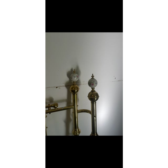 1980s queen headboard with porcelain floral painted decorative bulbs and double posts, fully brass