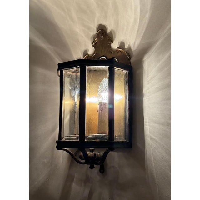 Exceptional pair of luxury handcrafted wall lantern sconces in the elegant french louis xv revival style. These impressive...