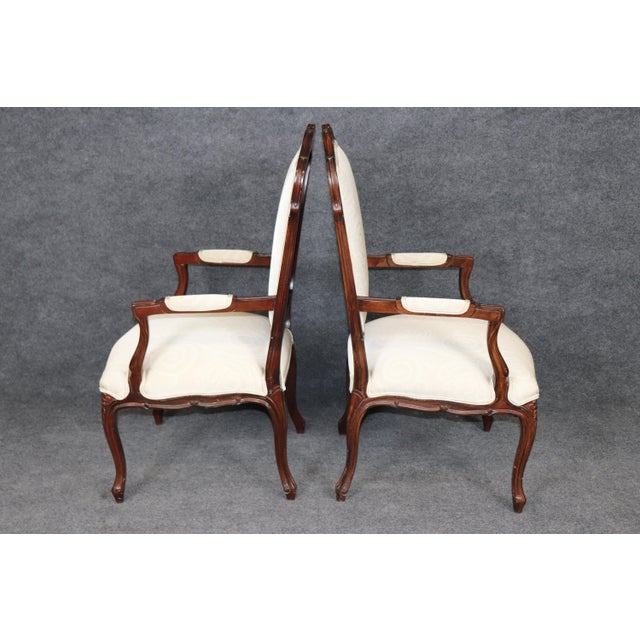 An extraordinary and increasingly difficult-to-find set of twelve French Louis XV style dining chairs, this impressive...