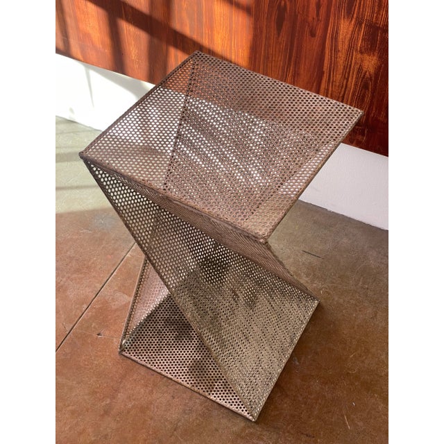 Perforated side table with origami motif in the style of Mathieu Matégot (unsigned), c. 1980s.