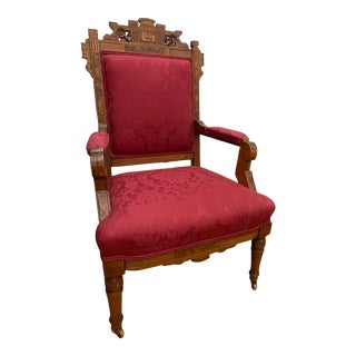 Early 20th Century Victorian Eastlake Arm Chair With Red Damask Upholstery and Casters For Sale