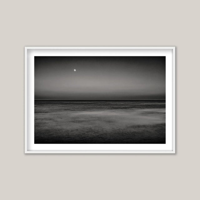 Moonrise IV, Selsey (BW) - a long-exposure, black and white photograph capturing twilight’s quiet transformation as the...