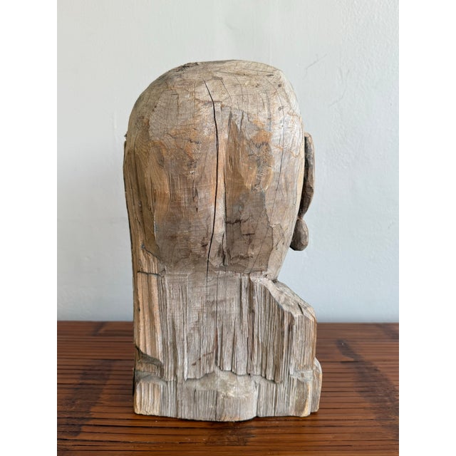 This raw, expressive bust is a powerful example of outsider or folk-inspired sculpture. Hand-carved from a single piece of...