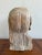 This raw, expressive bust is a powerful example of outsider or folk-inspired sculpture. Hand-carved from a single piece of...