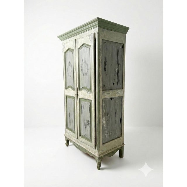 This armoire, which was made in France, was created with a genuine Old World finish, using layer upon layer of naturally...