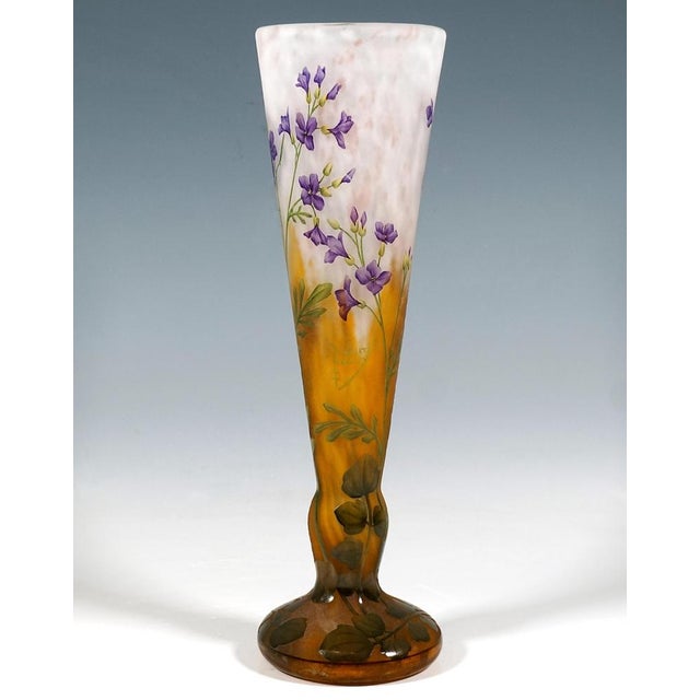 Funnel-shaped vase with a three-sided body resting on a round base set apart by a node; colourless glass with flaky white...