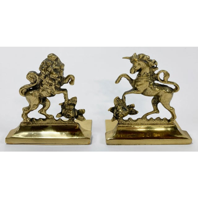 Vintage Victorian brass bookends depicting the Rose of Scotland with a Lion Rampant on one and a Unicorn on the other....
