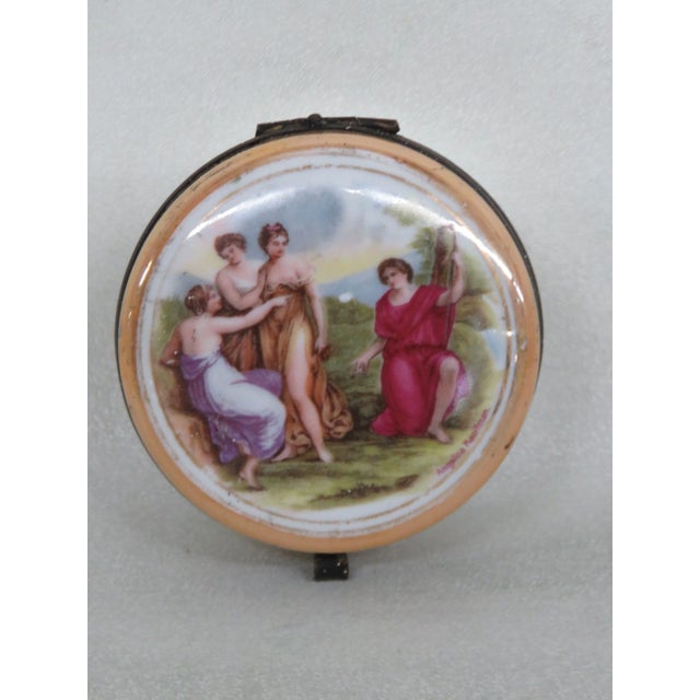 This lovely Trinket Box is made of porcelain with metal hinge. The Box has hand painted neoclassical Cameo on the top. The...