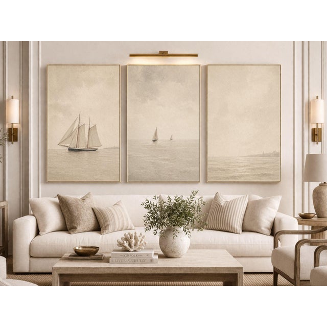 A refined trio of coastal studies featuring sailboats drifting across softly layered horizons, each rendered with subtle...