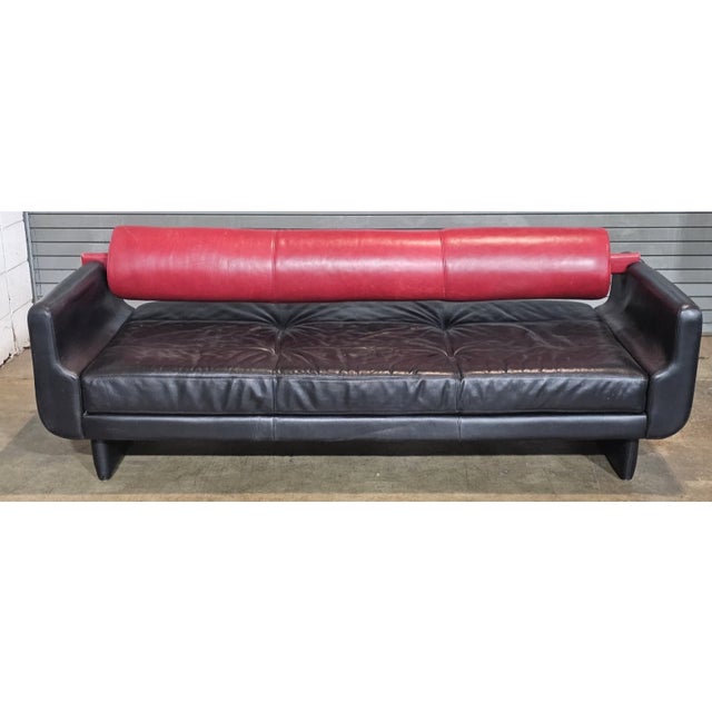 Store Item: Vladimir Kagan Matinee Sofa American Leather Red and Black Description: Roll Back Matinee Sofa featuring...
