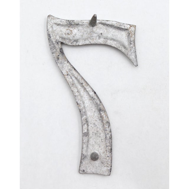 Vintage brushed steel aluminum 7 outdoor house or building marker with two prongs on the back. Good condition with surface...
