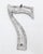 Vintage brushed steel aluminum 7 outdoor house or building marker with two prongs on the back. Good condition with surface...
