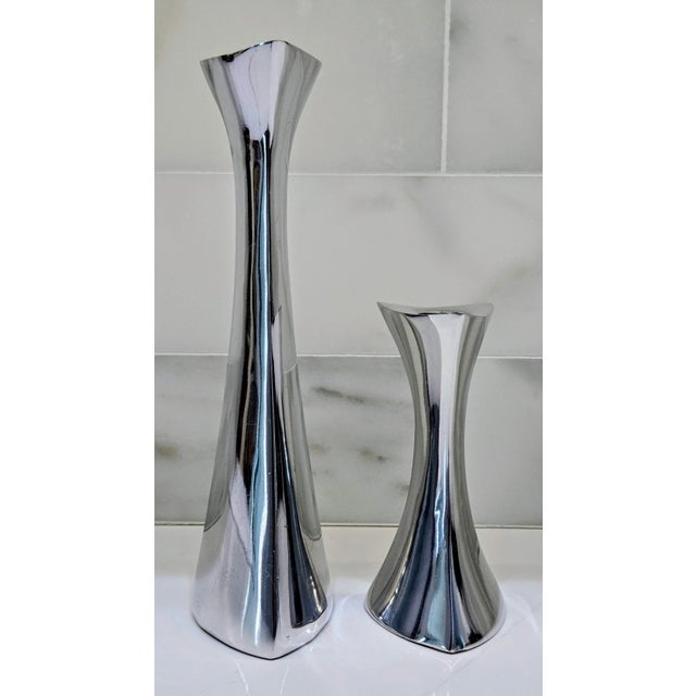 Striking and sculptural, this authentic Nambé model 596 candlestick pair showcases the brand’s signature mid-century...