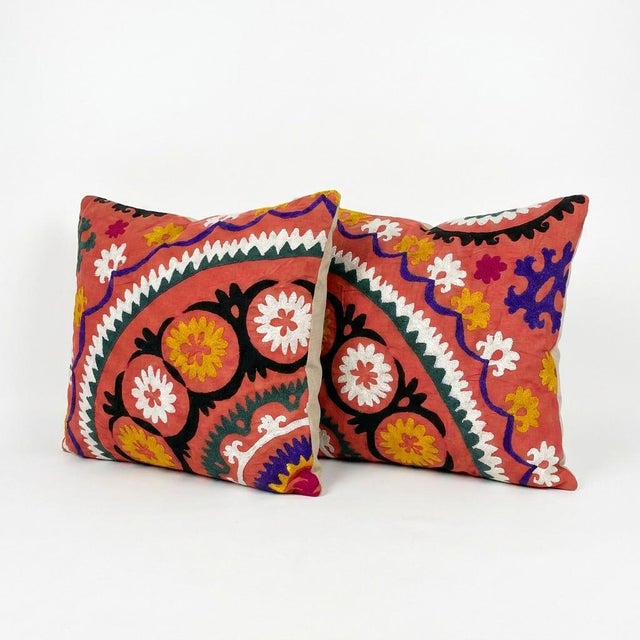 This beautiful 20'' x 23'' hand-embroidered Suzani pillow cover set was made from authentic Uzbek cotton fabric. The...