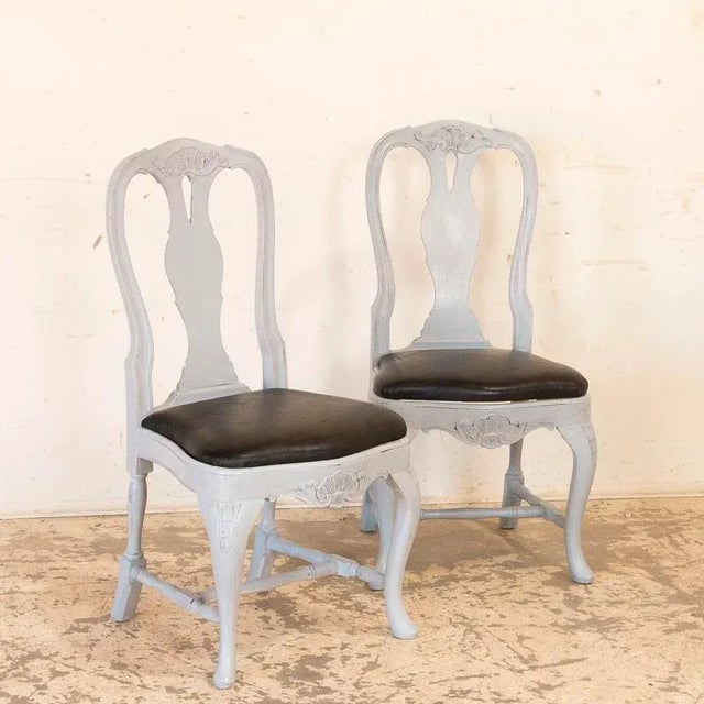 This wonderful set of twelve dining chairs exudes a graceful country charm. While likely from a Swedish farm house, these...
