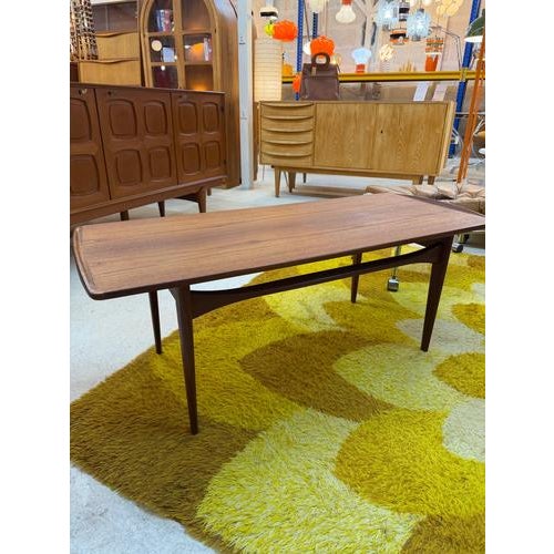 A masterpiece of Danish furniture design: This elegant coffee table, model 503, is crafted from exquisite teak and...