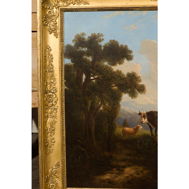 An Italian oil on canvas painting from the mid-19th century depicting cows, sheep and goats in pastures, in antique...