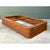 This vintage bed platform is a long, low, rectangular frame wrapped in a dense horizontal stack of slender rattan poles,...
