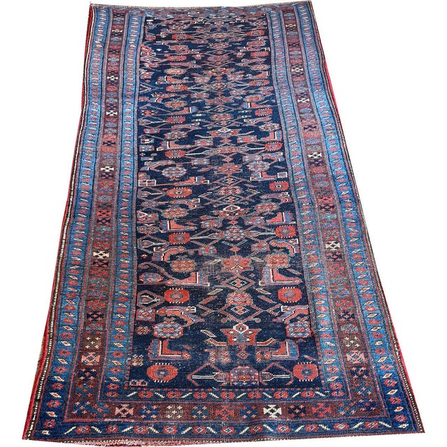 This is a hand-knotted Antique Tribal 4' x 10' Wool Bidjar Rug with a Herati/Fish pattern in blue. Made in the early...
