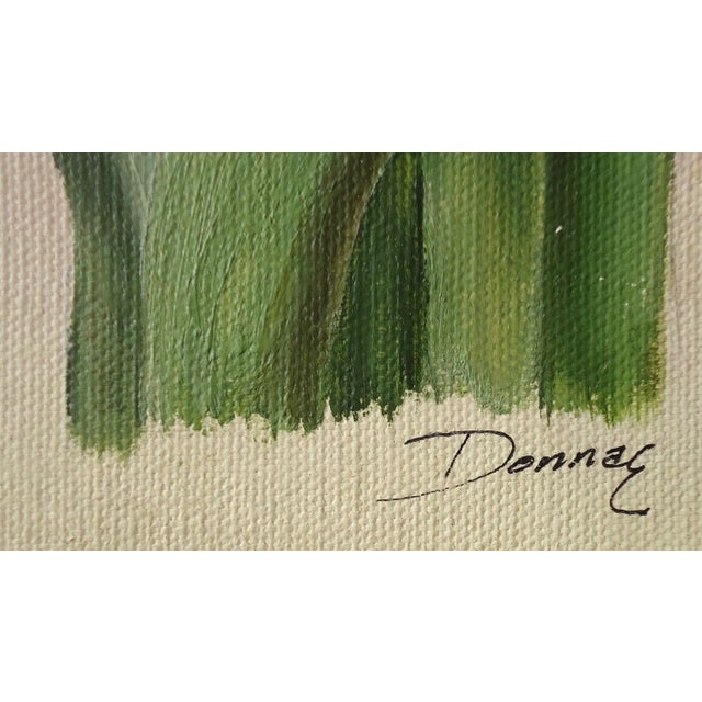 A lovely vintage painting on canvas of purple irises, signed Donna E. Condition is very good with light wear, the light...