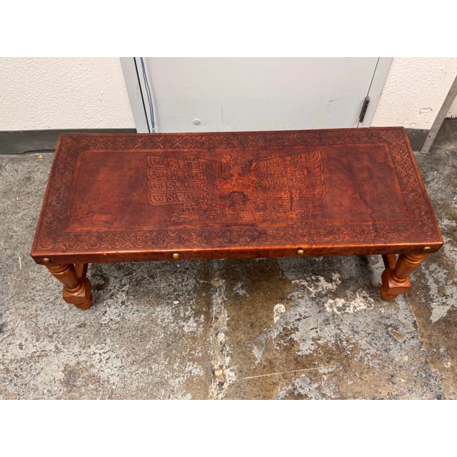 Design Plus Gallery presents a Chavín Culture Peruvian Tooled Leather Table Bench. This rectangular table bench has a...