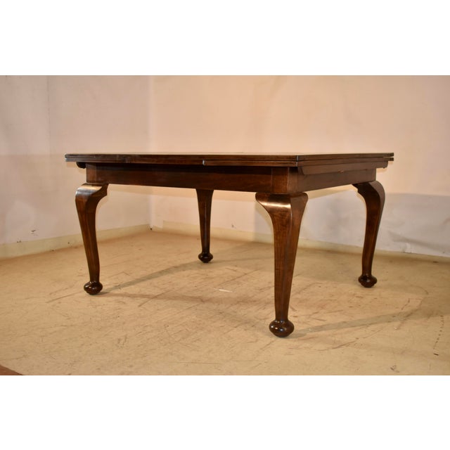 Period Edwardian mahogany draw leaf table from England. The table has paneled top and leaves, and when the leaves are...