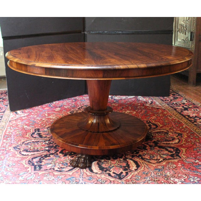 Circa 1835 William IV period center table or loo table, English. Vasi-form pedestal standard ending in voluminous flared...