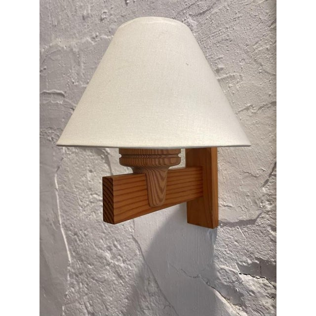 A refined pair of Scandinavian Modern wall sconces designed in the spirit of classic Nordic lighting. Created by Uno...