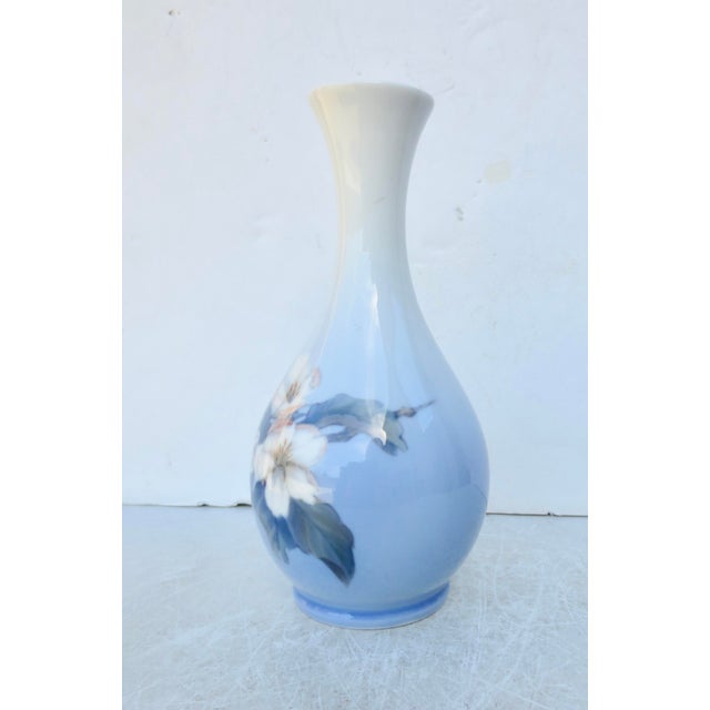 Royal Copenhagen Rose vase dated 1964 by backstops. Soft blue soft focus design in a porcelain bottle vase. Med blue...