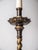 Floor lamp made of cast brass in the baroque style with a fabric shade. The shade is finished with decorative ports and...