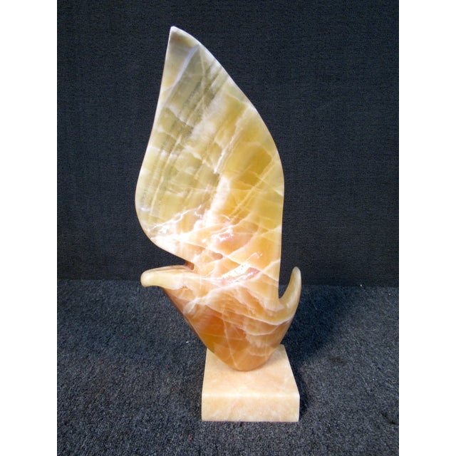 Beautiful alabaster sculpture by artist "Evelid Buti" A very unique piece that demands attention. From its flowing design...