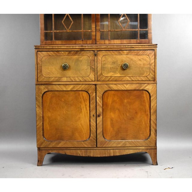 Circa 1820–1840 Mahogany Secretaire Bookcase / Display Cabinet A handsome and highly functional mahogany secretaire...