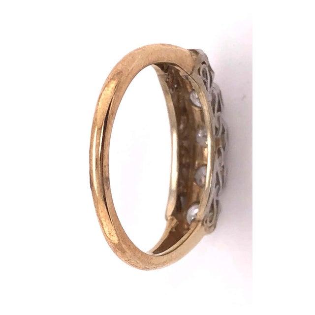 10Kt Two Tone Yellow and White Gold Crescent Ring With Five Diamonds Size 7. 0.45 total diamond weight. 2.55 grams total...