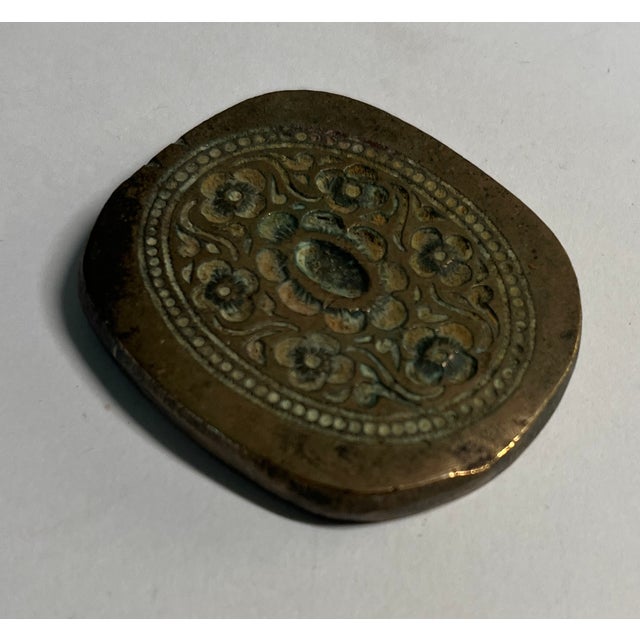 Decorative antique French button mold to use as a paperweight.