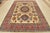 This traditional tribal geometric Caucasian Kazak rug is hand-knotted with an all-wool pile on a cotton foundation. This...