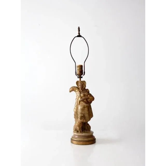 A striking vintage sculptural lamp by Russian-American artist Kupur, dating to the 1930s. The bronze-painted plaster...