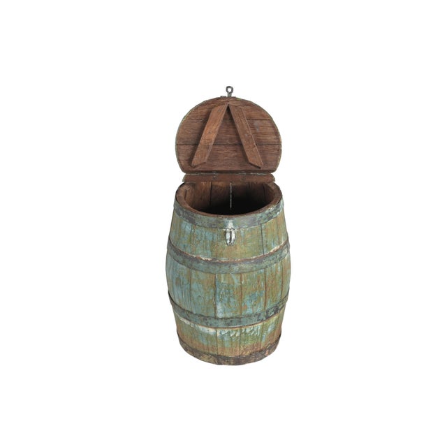 This Vintage Indian Painted Barrel with Lid Added is a charming and versatile piece that celebrates the character of...