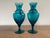 A fantastic pair of 1950s blue Empoli glass ewers with wonderfully twisted stems, bodies and handles. Condition is mint....