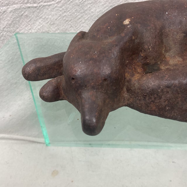 Antique iron reclining fox door stop. This doorstop has not been painted. Very heavy with good detail. He looks like he is...
