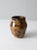 Vintage signed studio pottery pitcher featuring a hand-crafted ceramic form with a striking black and tan glaze. The...