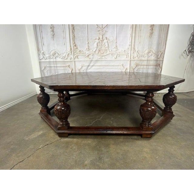 An extraordinary statement of grandeur and craftsmanship, this monumental octagonal coffee table commands presence like a...