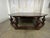 An extraordinary statement of grandeur and craftsmanship, this monumental octagonal coffee table commands presence like a...