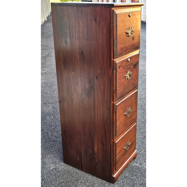 A Late 20th Century Four-Drawer Solid Pine Filing Cabinet with Locks and Keys in the old tavern style, with built-in file...
