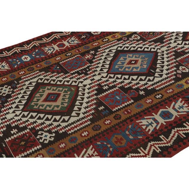 Hand woven in Turkey originating between 1950-1960, this vintage mid-century 6×10 wool kilim hails from the town of...