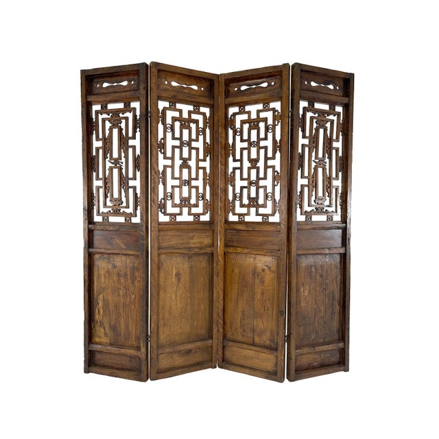 Gorgeous antique hinged room divider screen featuring four hand-carved elm panels. At nearly 8 feet tall, this stunning...